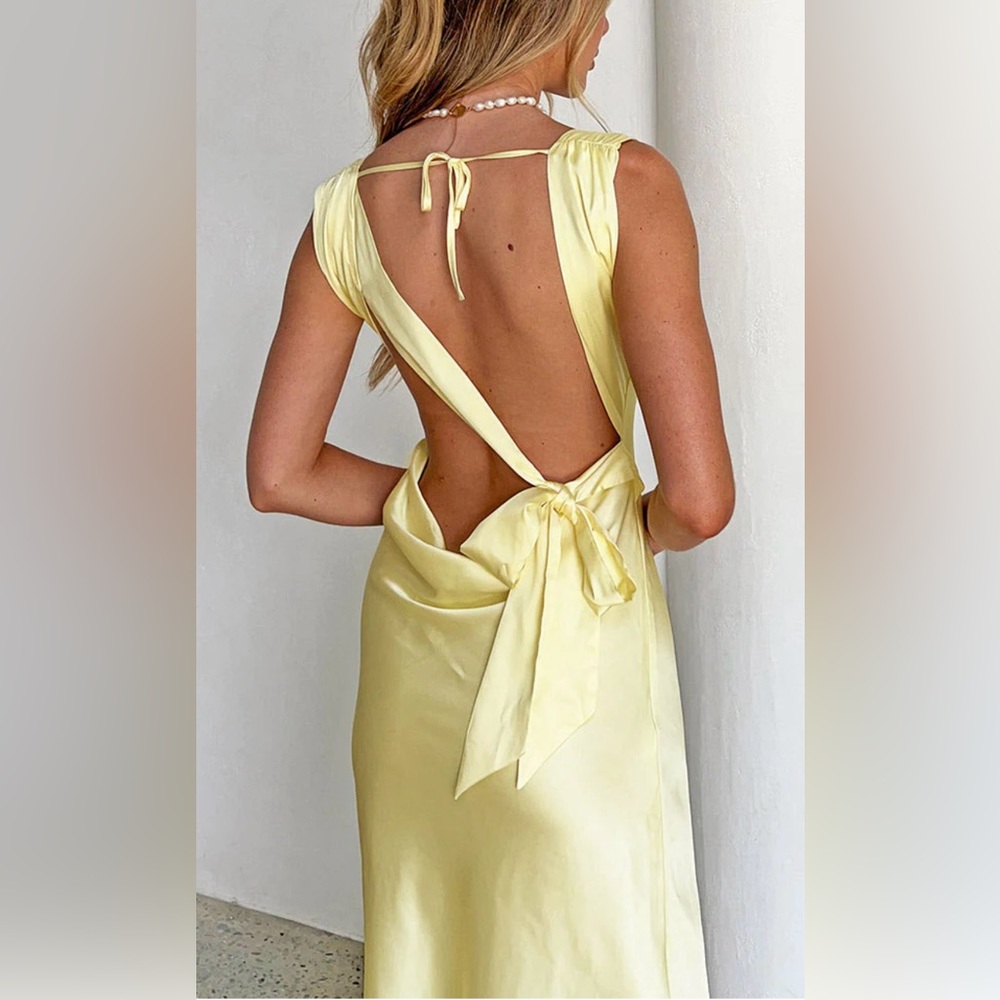 NEVER WORN beautiful yellow dress with open back
